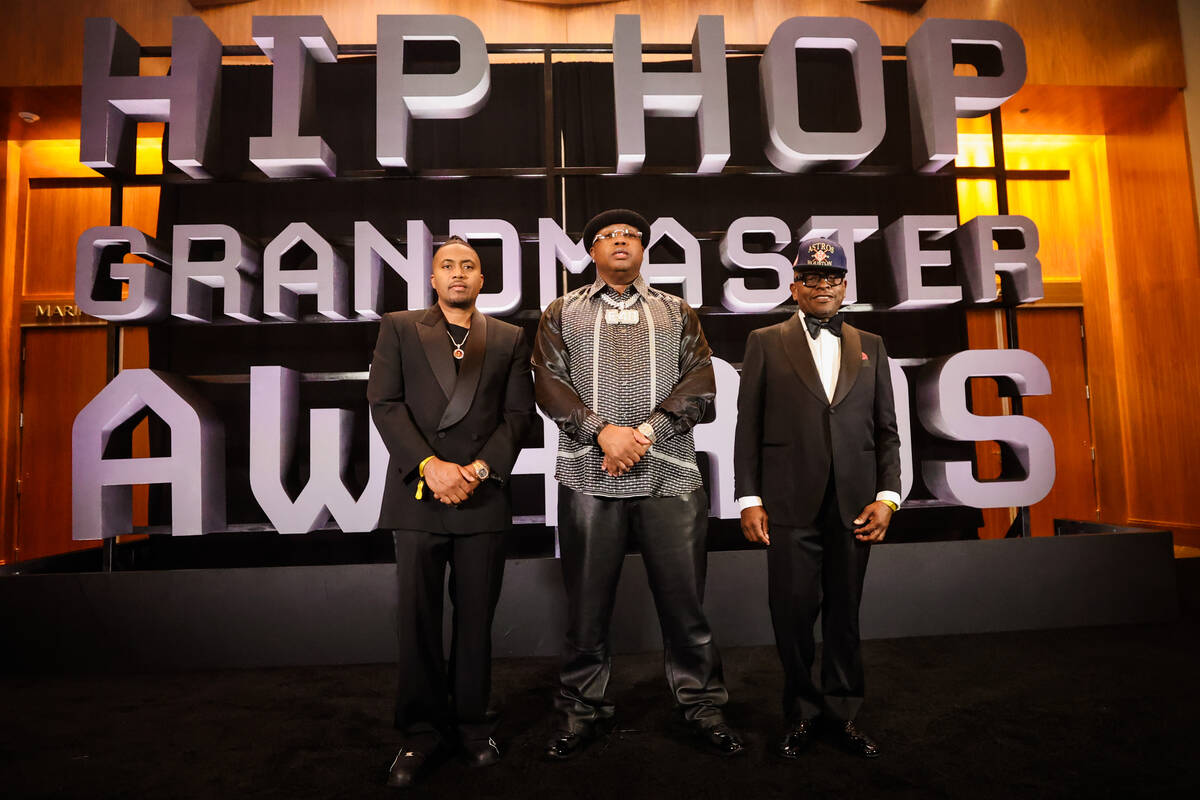 Was, from left, E-40 and Scarface all pose together on the red carpet during the Paid in Full F ...