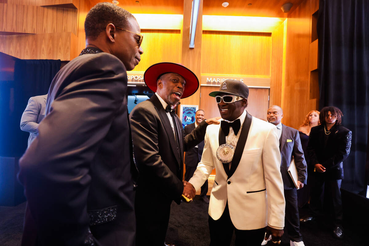 Doug E. Fresh, from left, Grandmaster Caz and Flavor Flav socialize during the Paid in Full Fou ...