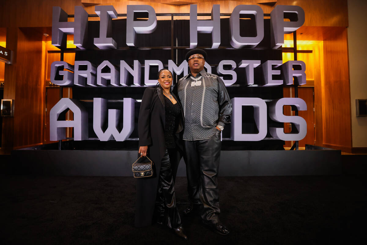 E-40, right, poses on the red carpet with his wife, Tracy Stevens during the Paid in Full Found ...