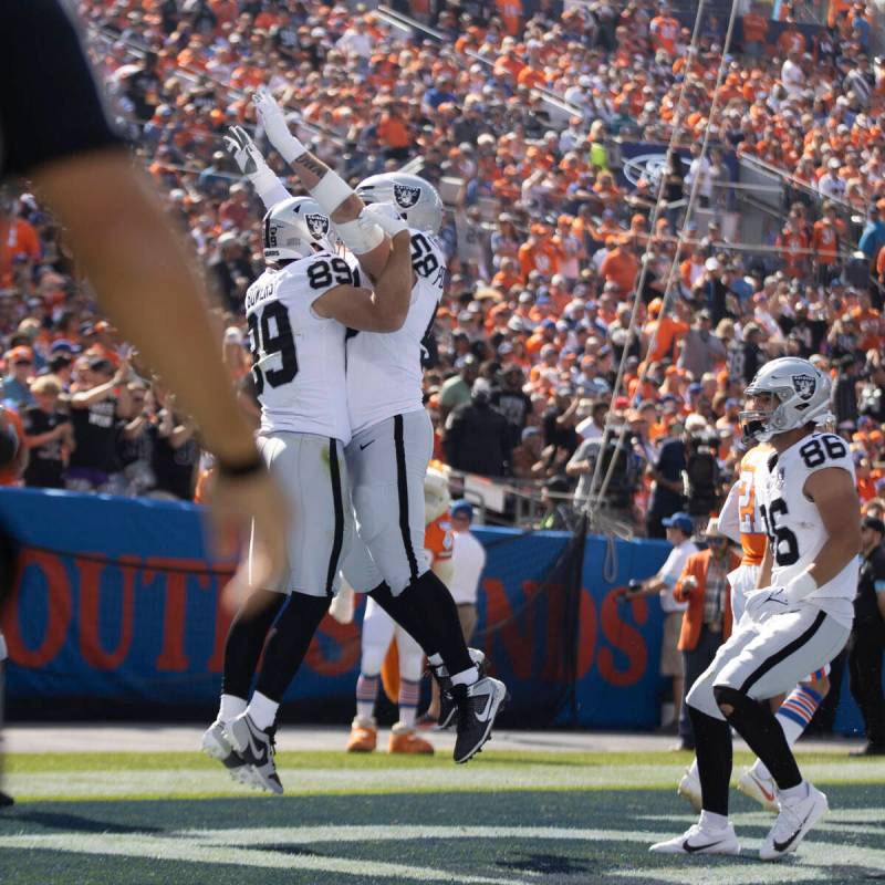 Raiders tight end Brock Bowers (89) celebrates his touchdown score with guard Jackson Powers-Jo ...