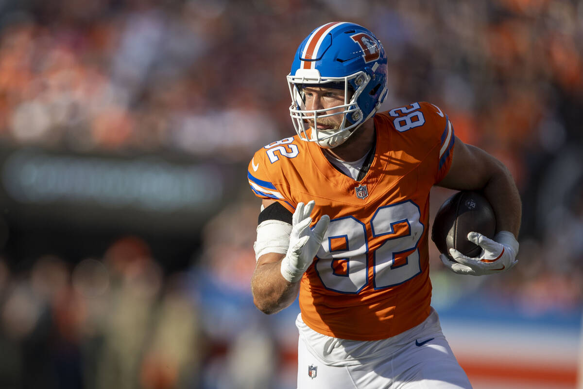 Denver Broncos tight end Adam Trautman (82) runs after a catch during second half of an NFL gam ...