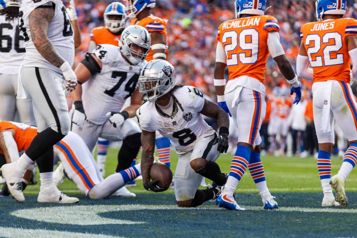 Raiders running back Ameer Abdullah (8) scores a touchdown against the Denver Broncos during th ...