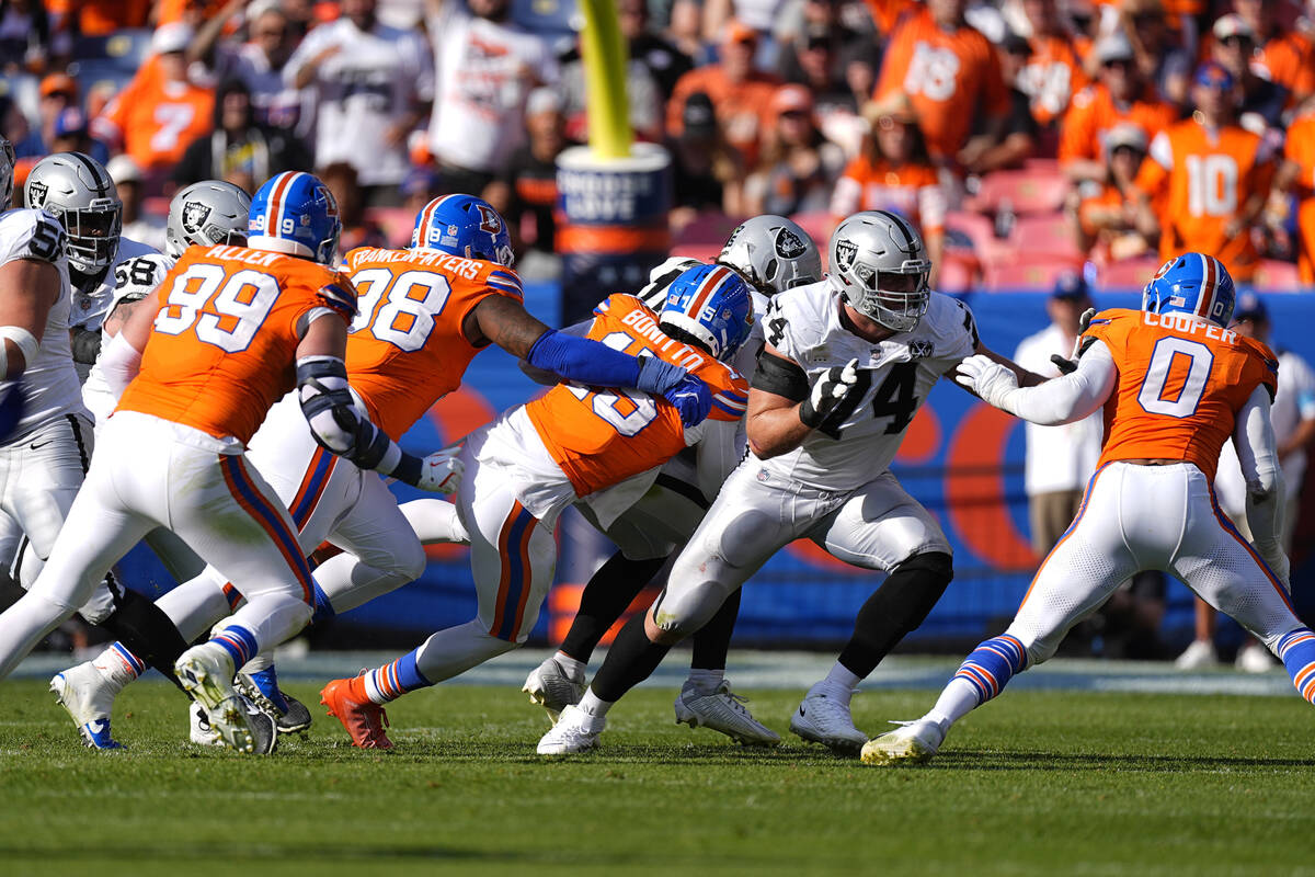 Denver Broncos linebacker Nik Bonitto (15) sacks Las Vegas Raiders quarterback Gardner Minshew ...