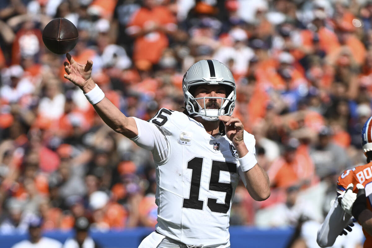 Las Vegas Raiders quarterback Gardner Minshew throws during the first half of an NFL football g ...