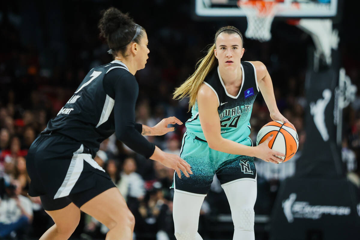 New York Liberty guard Sabrina Ionescu (20) focuses on finding an open teammate to pass the bal ...