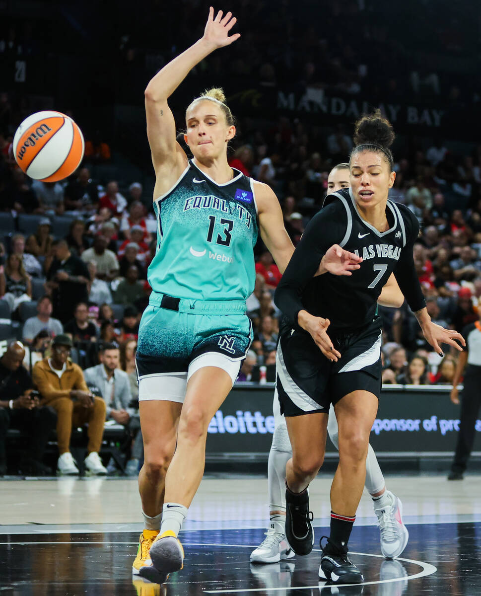 New York Liberty forward Leonie Fiebich (13) and Aces forward Alysha Clark (7) race for the bal ...