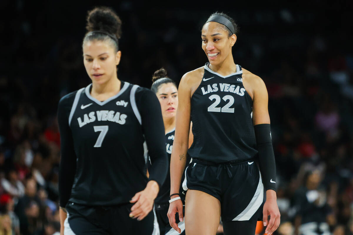 Aces center A'ja Wilson (22) smiles as she walks back onto the court during the last few minute ...