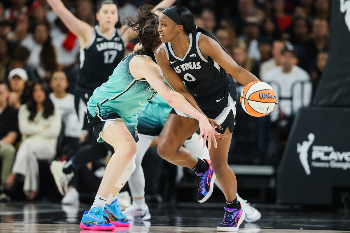 Aces guard Jackie Young (0) dribbles the ball while New York Liberty forward Breanna Stewart (3 ...