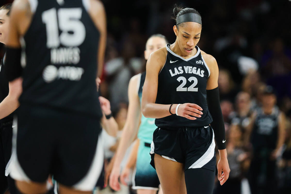 Aces center A'ja Wilson (22) looks down during game four of a WNBA semifinals playoff series be ...