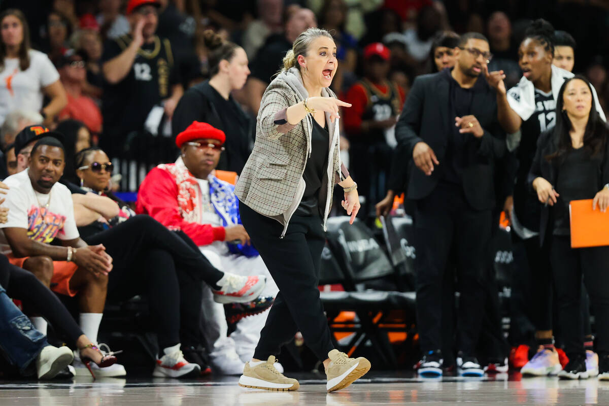 Aces head coach Becky Hammon coaches from the sidelines during game four of a WNBA semifinals p ...