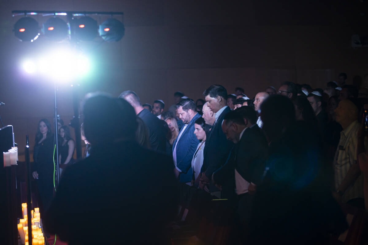 People, including Republican senatorial candidate Sam Brown, listen during an event marking one ...