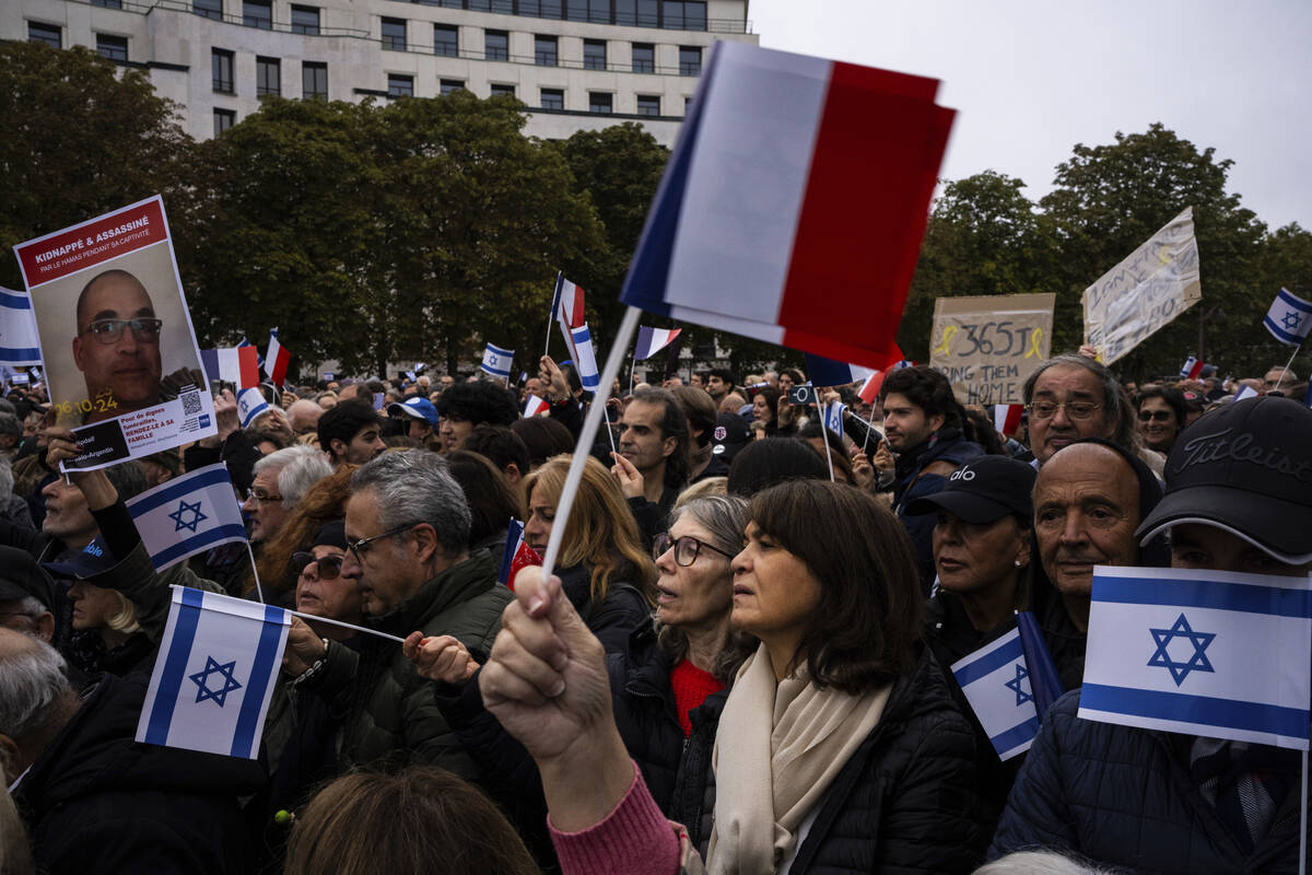 People attend a demonstration in support of Israel to mark the first anniversary of the Hamas a ...