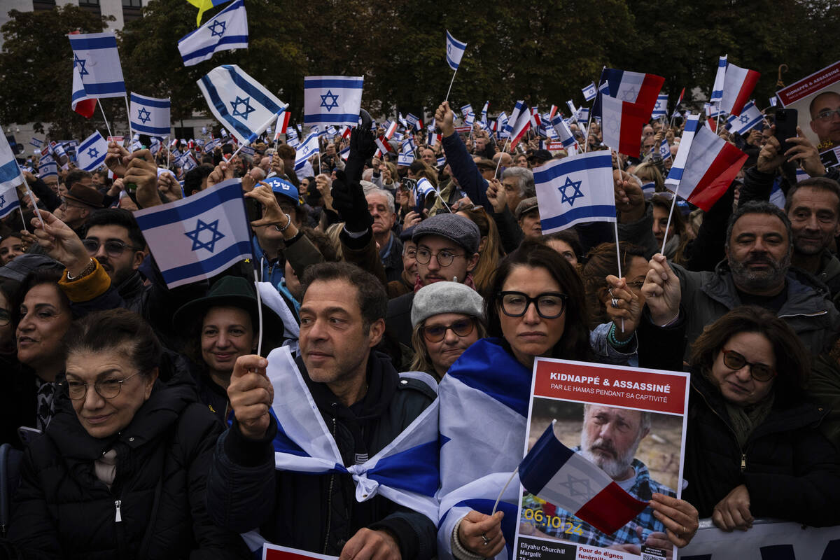 People attend a demonstration in support of Israel to mark the first anniversary of the Hamas a ...