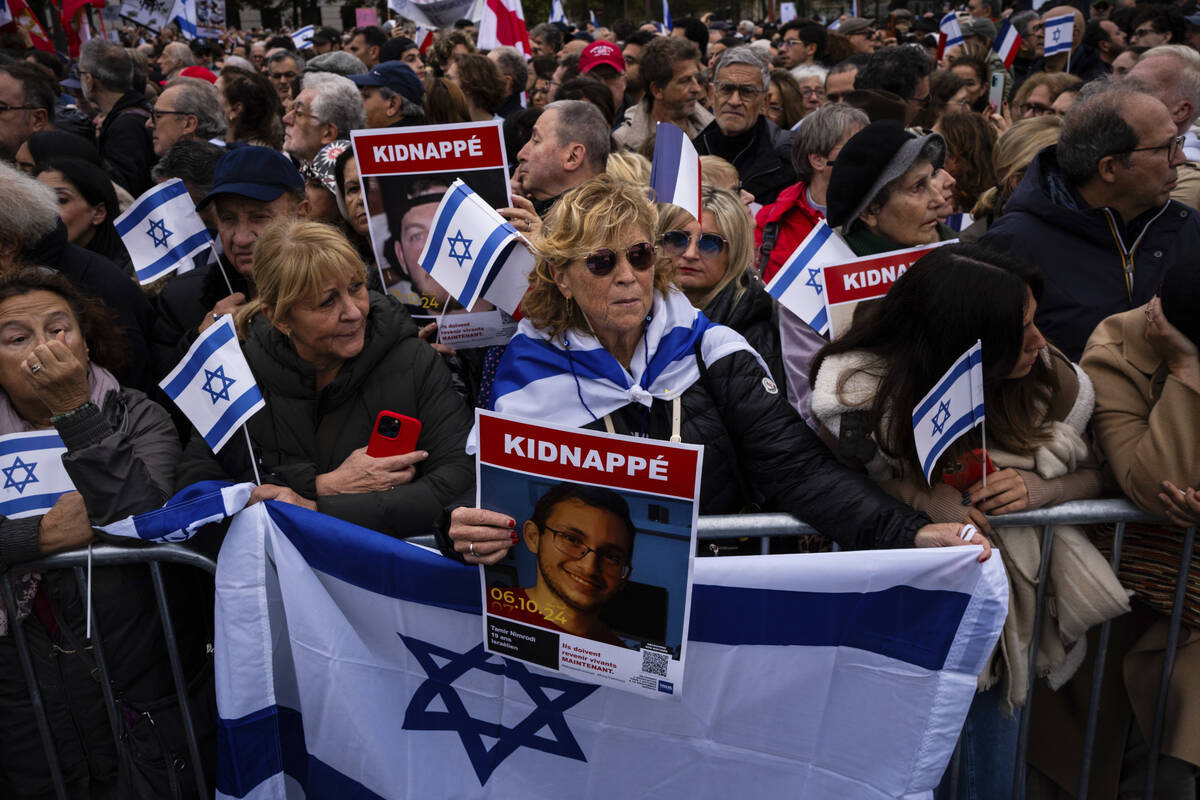 People attend a demonstration in support of Israel to mark the first anniversary of the Hamas a ...