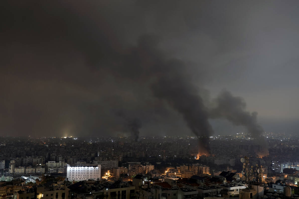 Flames and smoke rise from an Israeli airstrike in Dahiyeh, Beirut, Lebanon, early Monday, Oct. ...