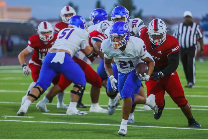 Bishop Gorman running back Jonathan Coar (21) runs the ball towards the end zone during a high ...