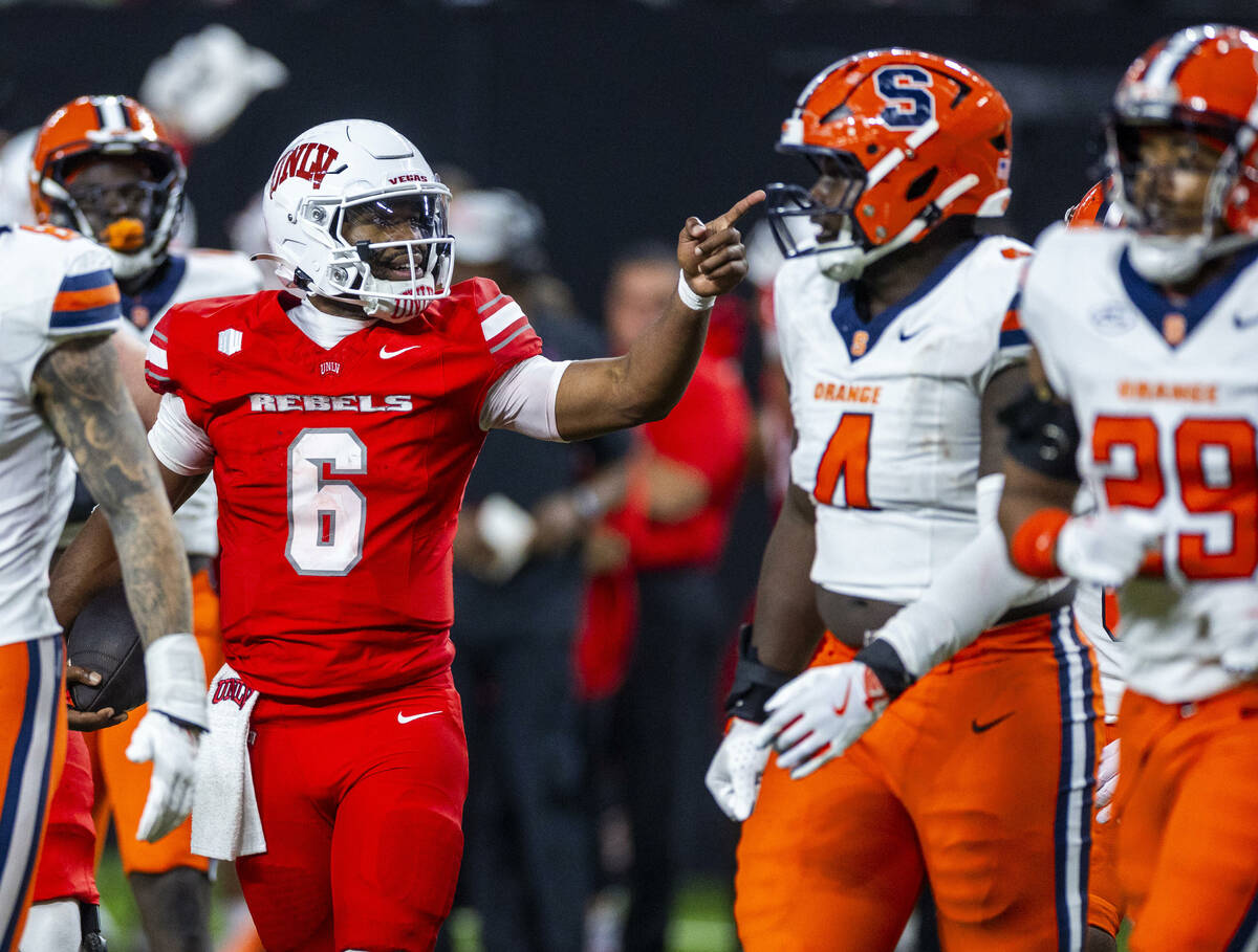 UNLV quarterback Hajj-Malik Williams (6) points to a first down on a run against Syracuse Orang ...