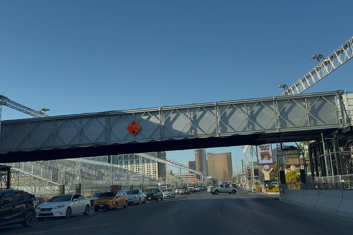 Traffic on Koval Lane, near Grand Prix Plaza, where Las Vegas Grand Prix track lighting install ...