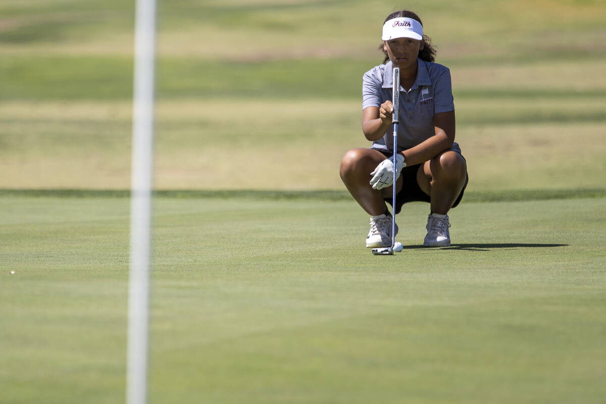 Faith Lutheran’s Macy Garth lines up her putt during the 5A Desert League girls golf mat ...