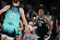 Aces guard Chelsea Gray (12) dribbles the ball down the court during game three of a WNBA semif ...