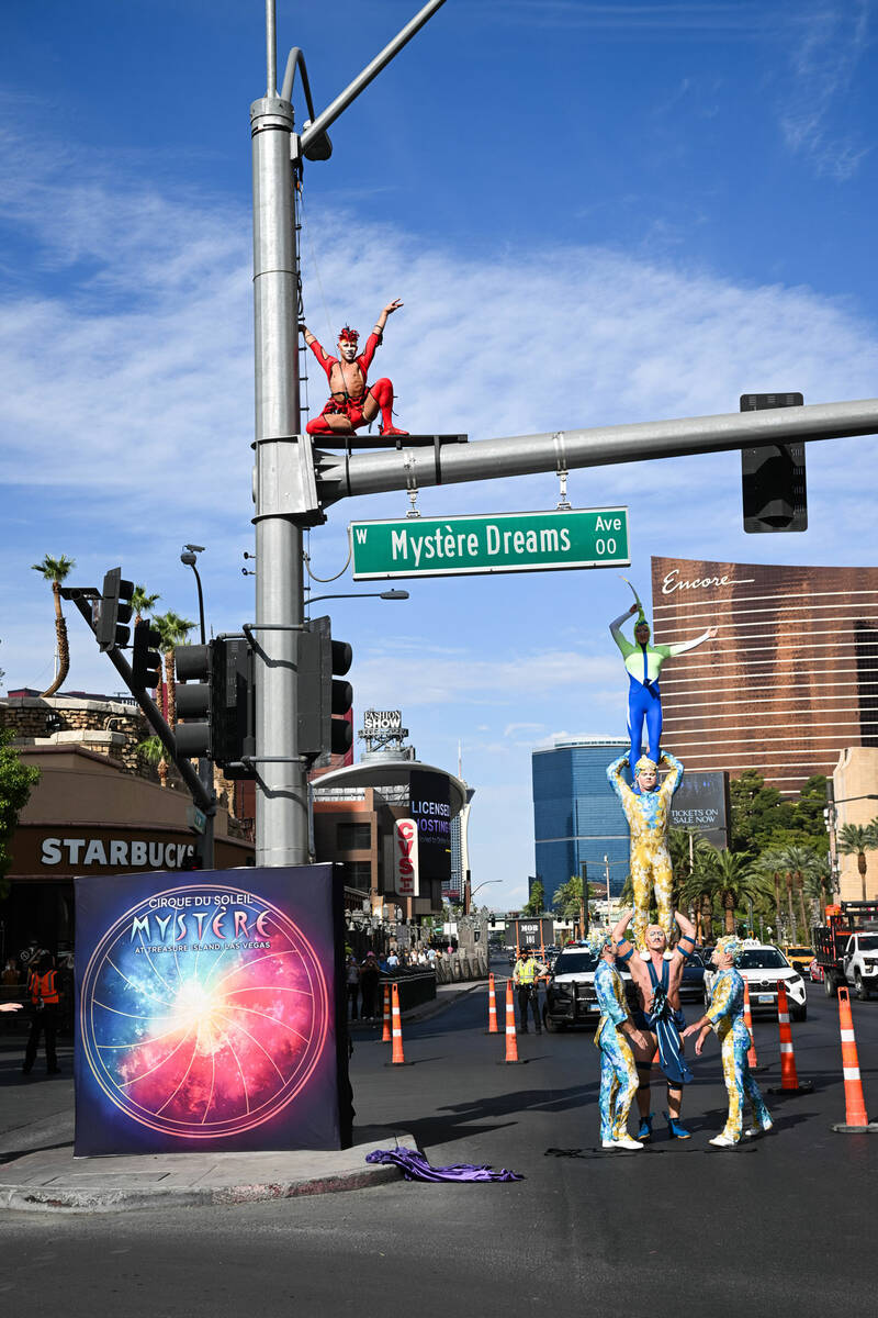 Cirque du Soleil performers for "Mystère" unveil the Mystère Dreams Ave sign on the Las Vegas ...