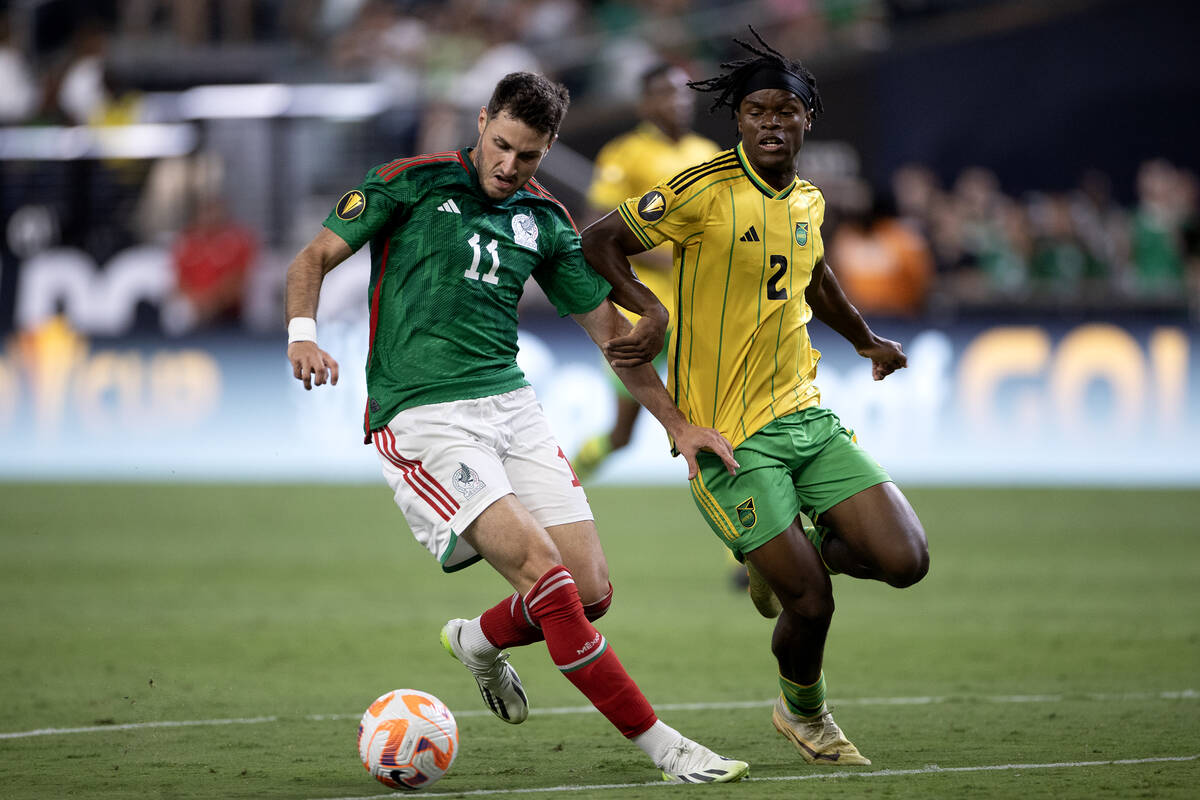 Mexico forward Santiago Giménez (11) dribbles for the net against Jamaica defender Dexter ...