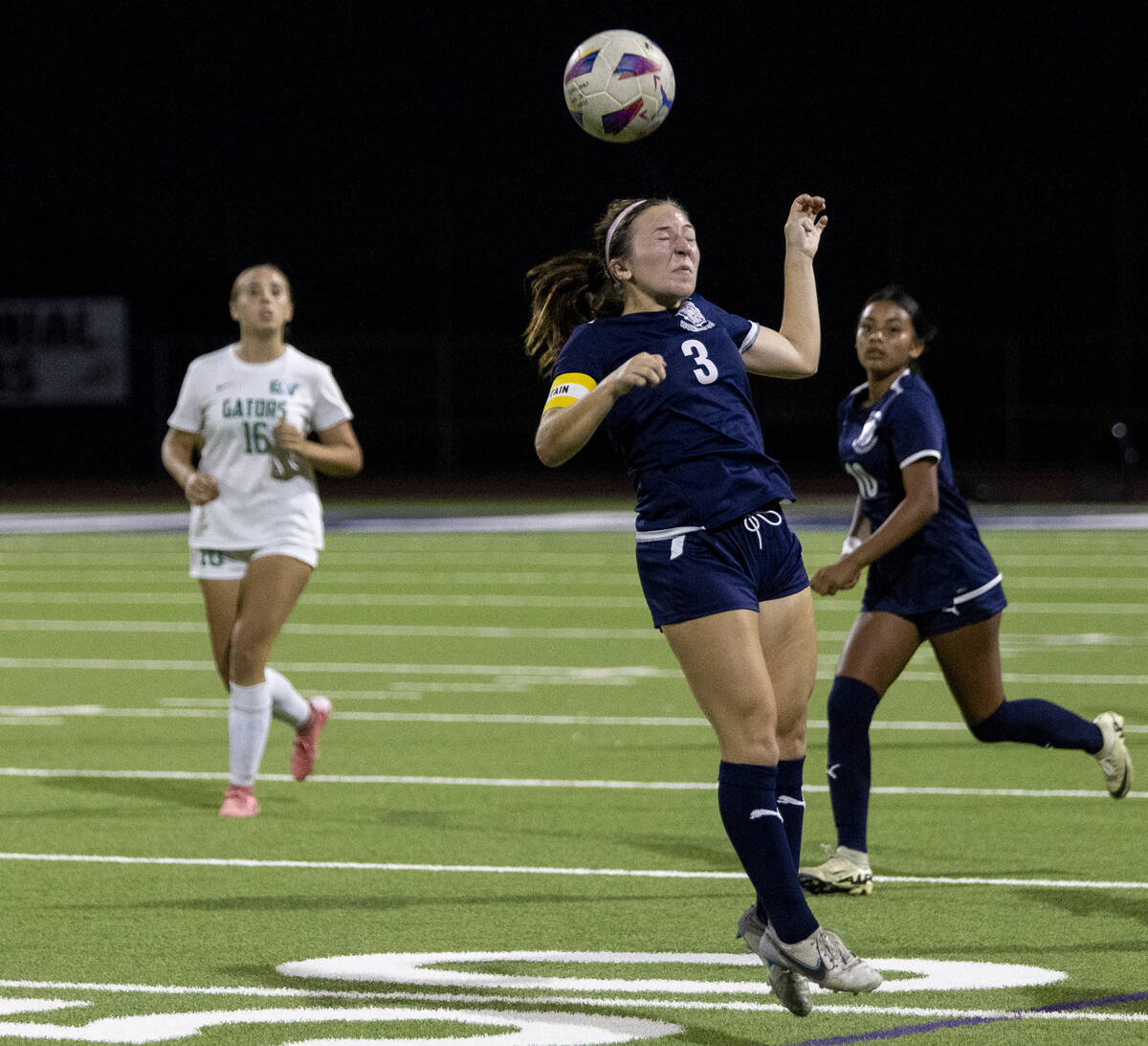 Centennial forward Natalie Sligar (3) jumps for the ball during the high school soccer game aga ...