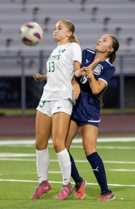 Green Valley sophomore Payton Colbrook (13) and Centennial midfielder Julianne Donnelly (16) ju ...