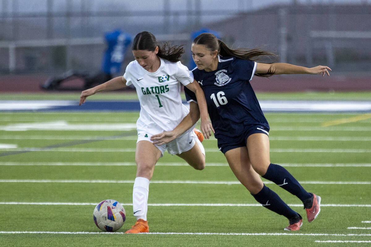 Green Valley midfielder Melody McCormick (1) and Centennial midfielder Julianne Donnelly (16) c ...