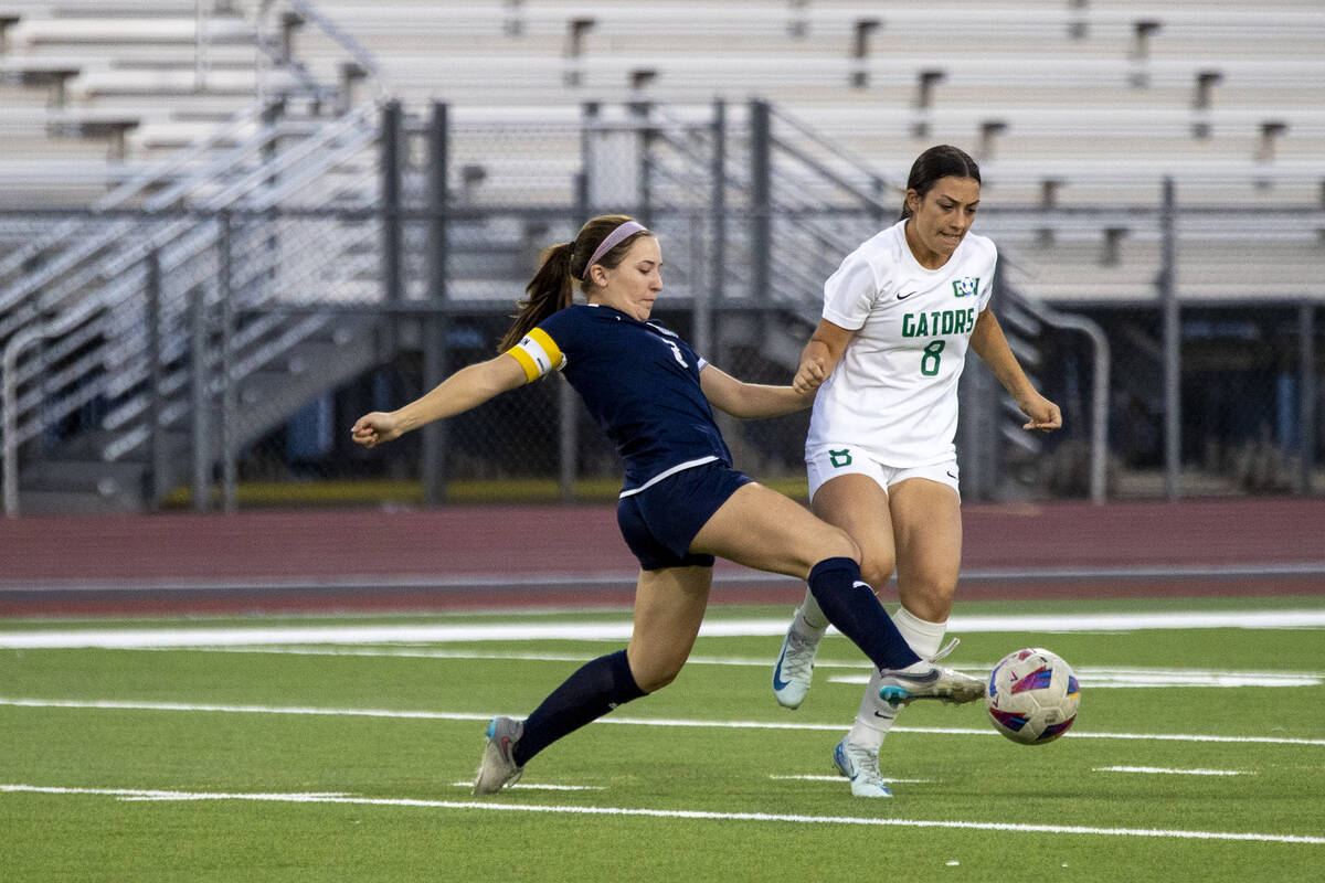 Centennial forward Natalie Sligar (3) and Green Valley midfielder Azlyn Olofson (8) compete for ...