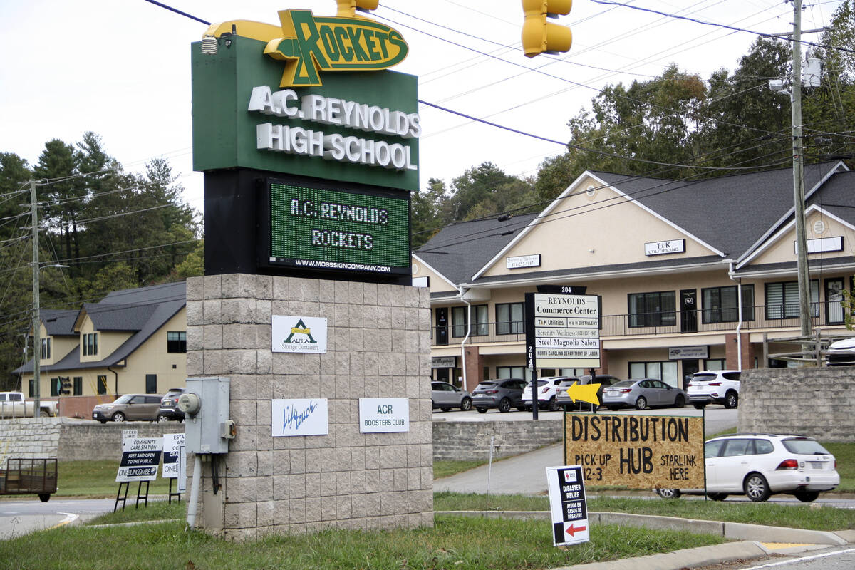 Signs are seen at a FEMA Disaster Recovery Center at A.C. Reynolds High School in Asheville, N. ...