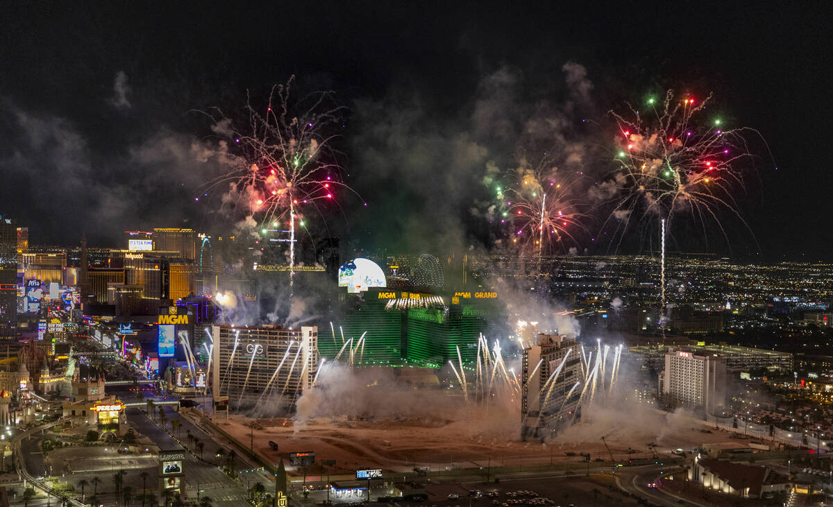 A fireworks and drone show precedes the Tropicana being imploded early in the morning while vie ...