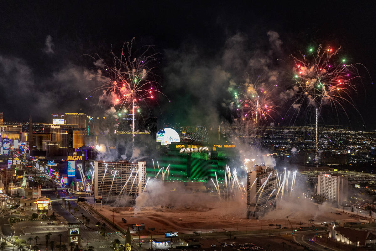 A fireworks and drone show precedes the Tropicana being imploded early in the morning while vie ...