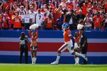 Denver Broncos cornerback Pat Surtain II (2) intercepts a pass for a 100 yard touchdown against ...