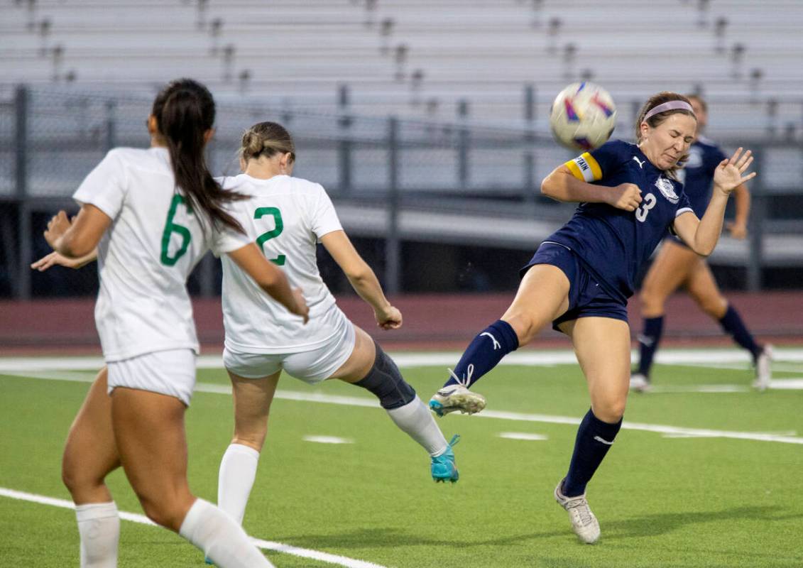 Centennial forward Natalie Sligar (3) blocks the ball during the high school soccer game agains ...