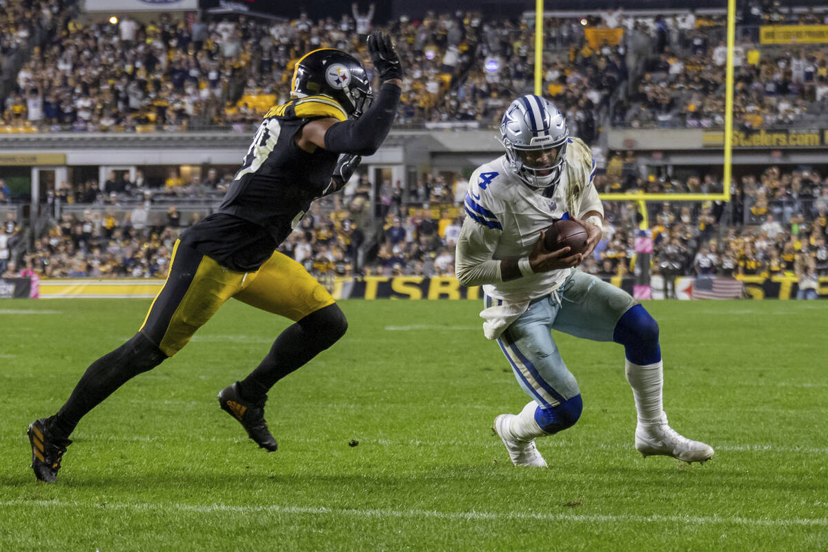 Dallas Cowboys quarterback Dak Prescott (4) dives for the end zone in front of Pittsburgh Steel ...