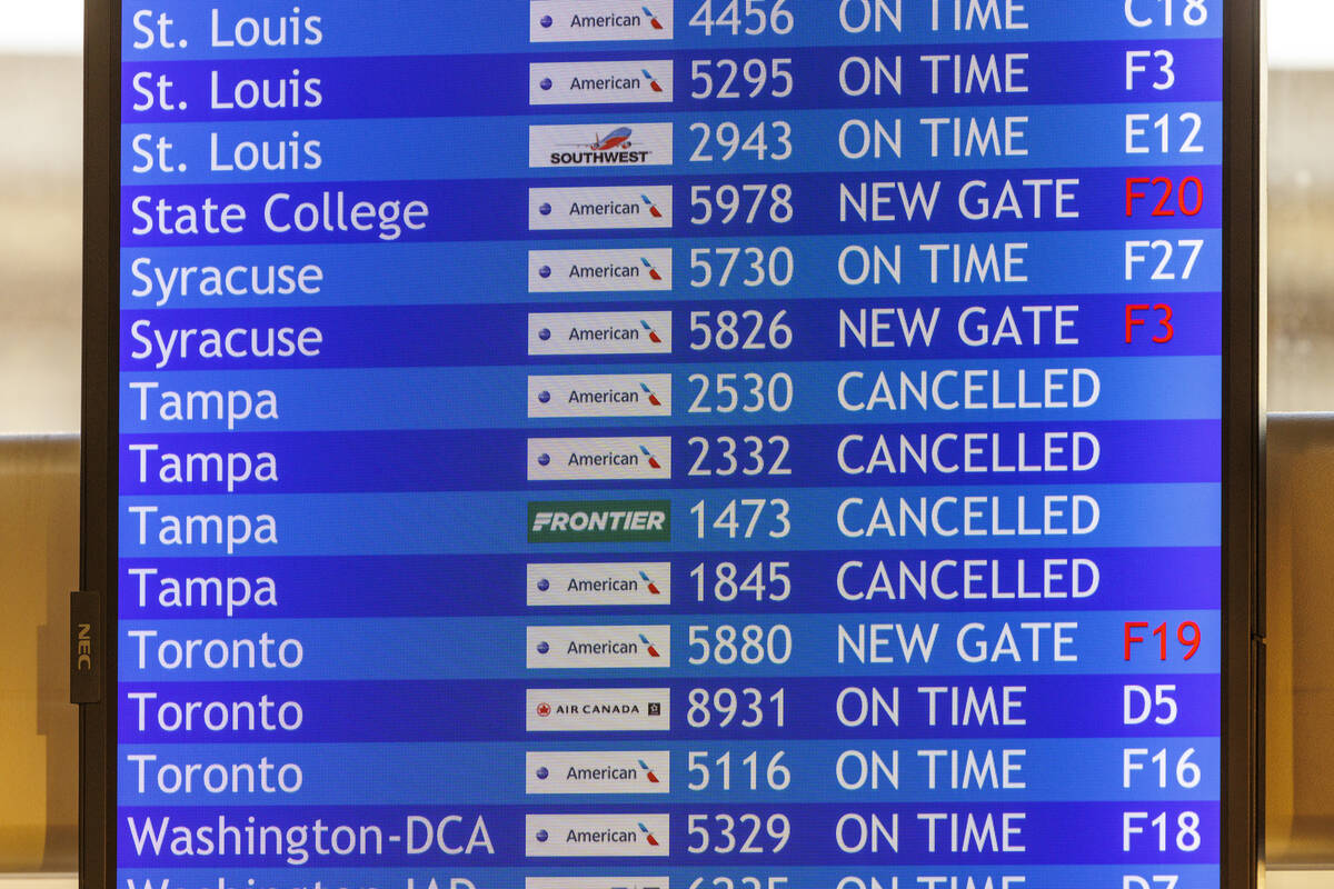 Flight information board with cancelled flights to Tampa is shown on Wednesday, Oct. 9, 2024 at ...