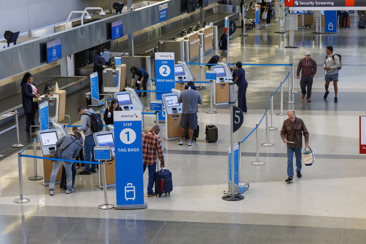 Travelers check in as flights to Tampa, Fla., are canceled due to Hurricane Milton on Wednesday ...