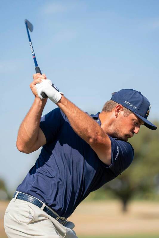 Captain Bryson DeChambeau of Crushers GC hits his shot on the driving range during the final ro ...