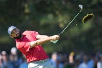 United States team member Scottie Scheffler hits his approach shot on the 2nd hole during their ...