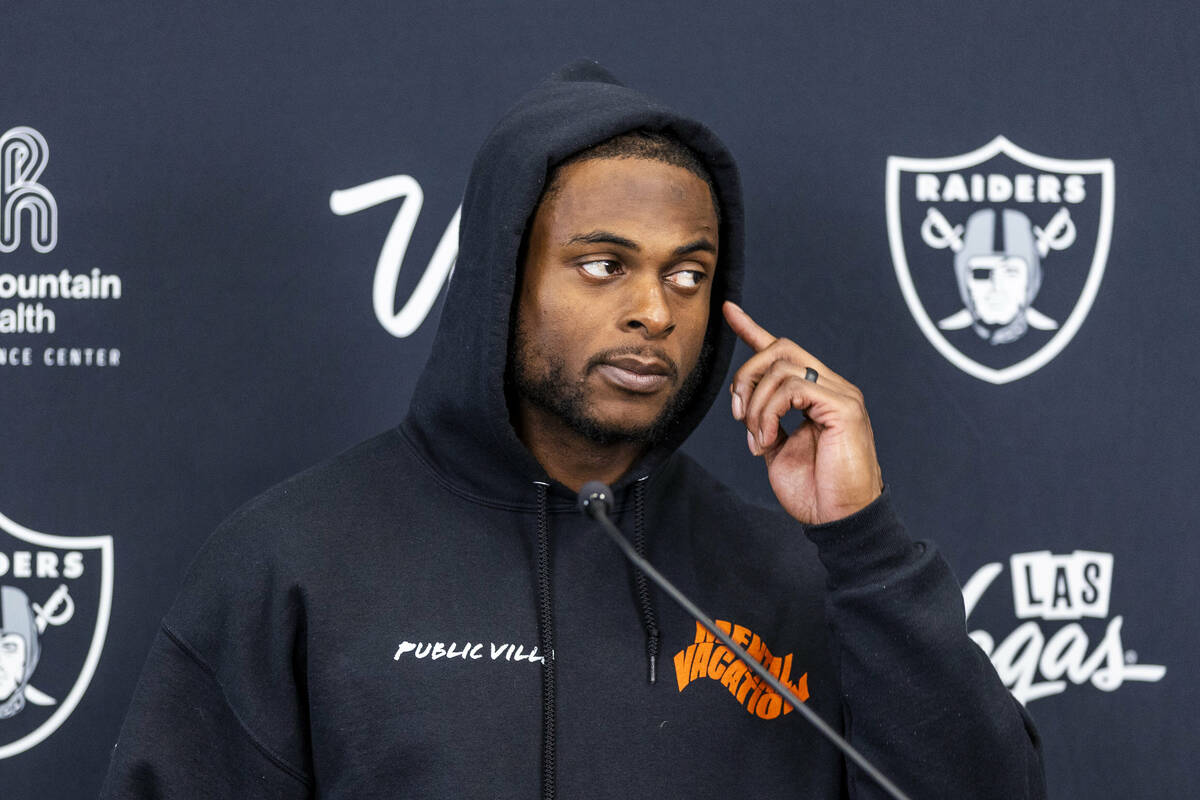 Raiders wide receiver Davante Adams (17) listens to a question during a media interview at the ...