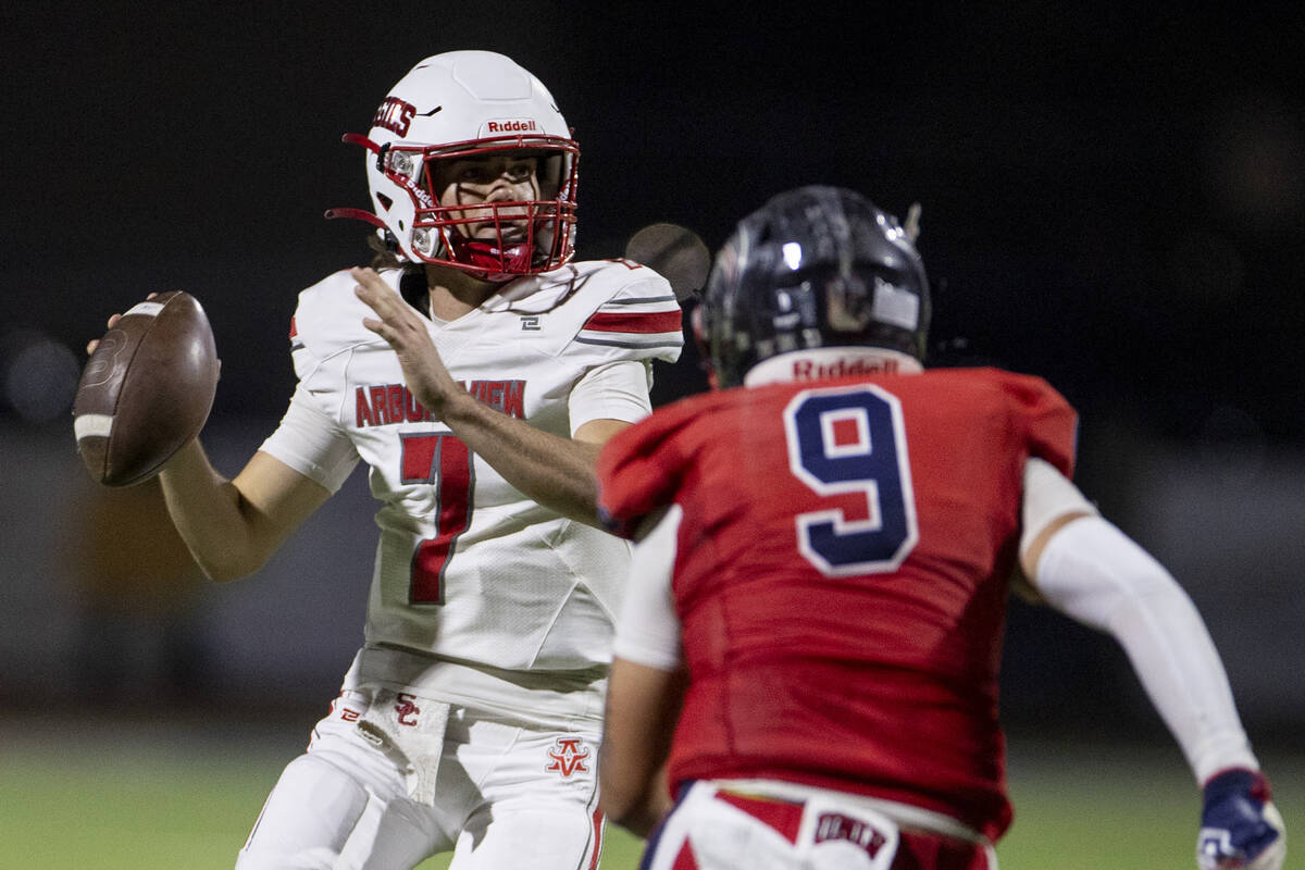 Arbor View quarterback Thaddeus Thatcher (7) looks to throw the ball during the high school foo ...