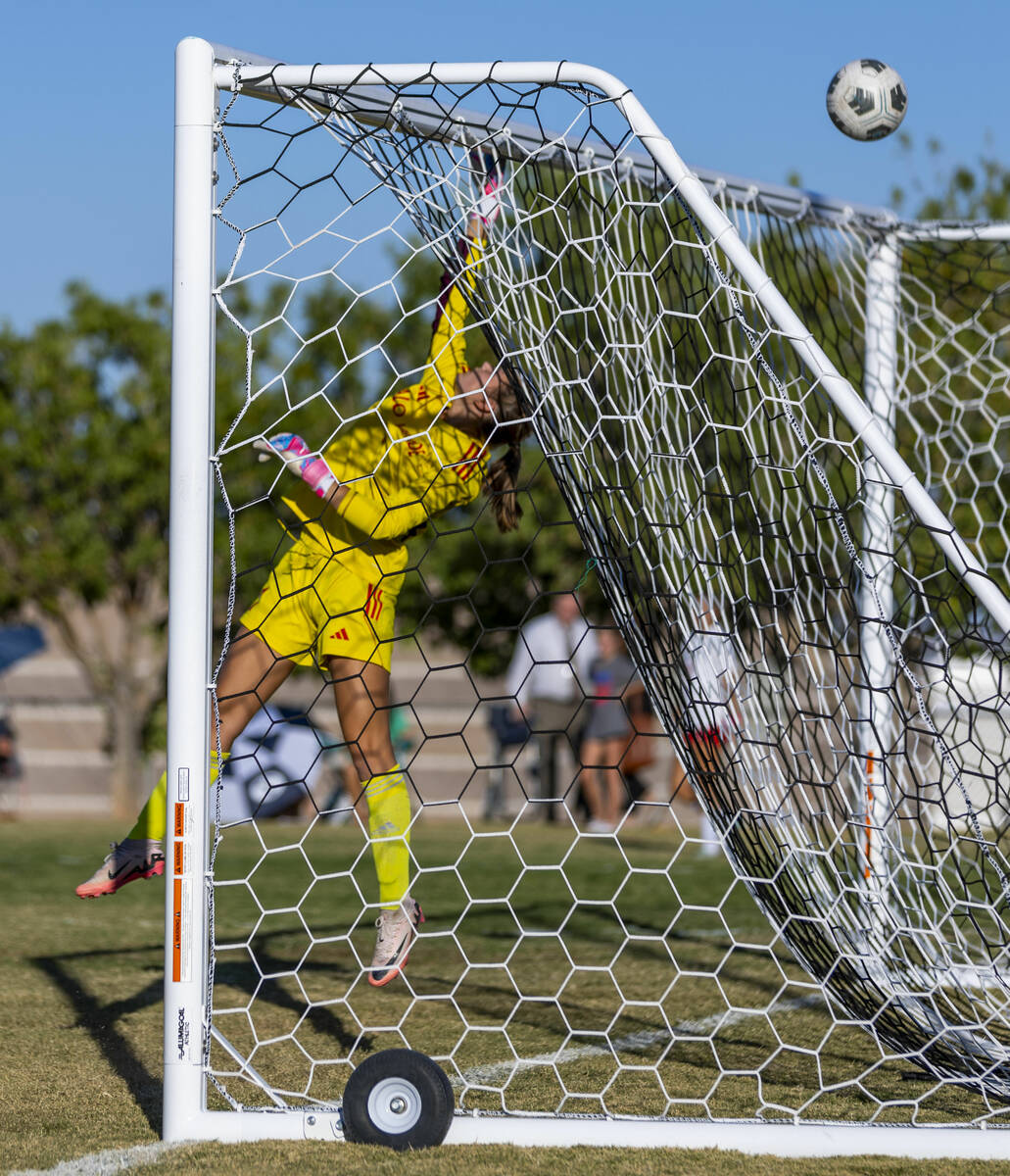 Palo Verde goalkeeper Taylor Bringhurst (1) elevates to ensure a ball gets over the post kicked ...