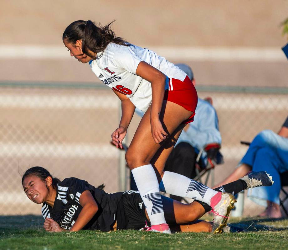 Palo Verde forward Angelie Mendoza (23) is taken down by Liberty defender Nai'a Pomaikai (16) d ...