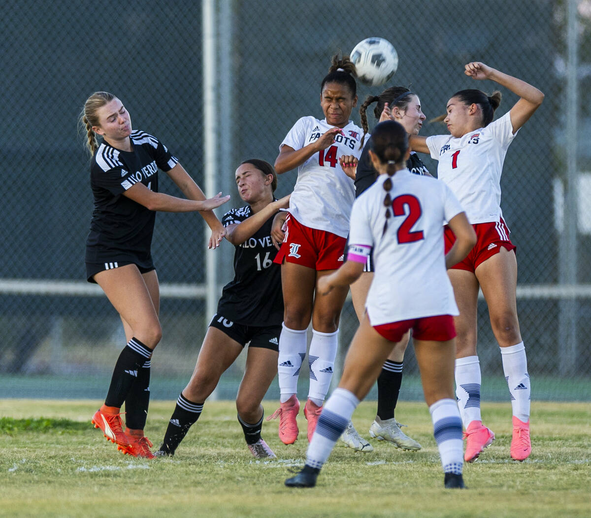 Liberty and Palo Verde players battle for a header during the second half of their NIAA soccer ...