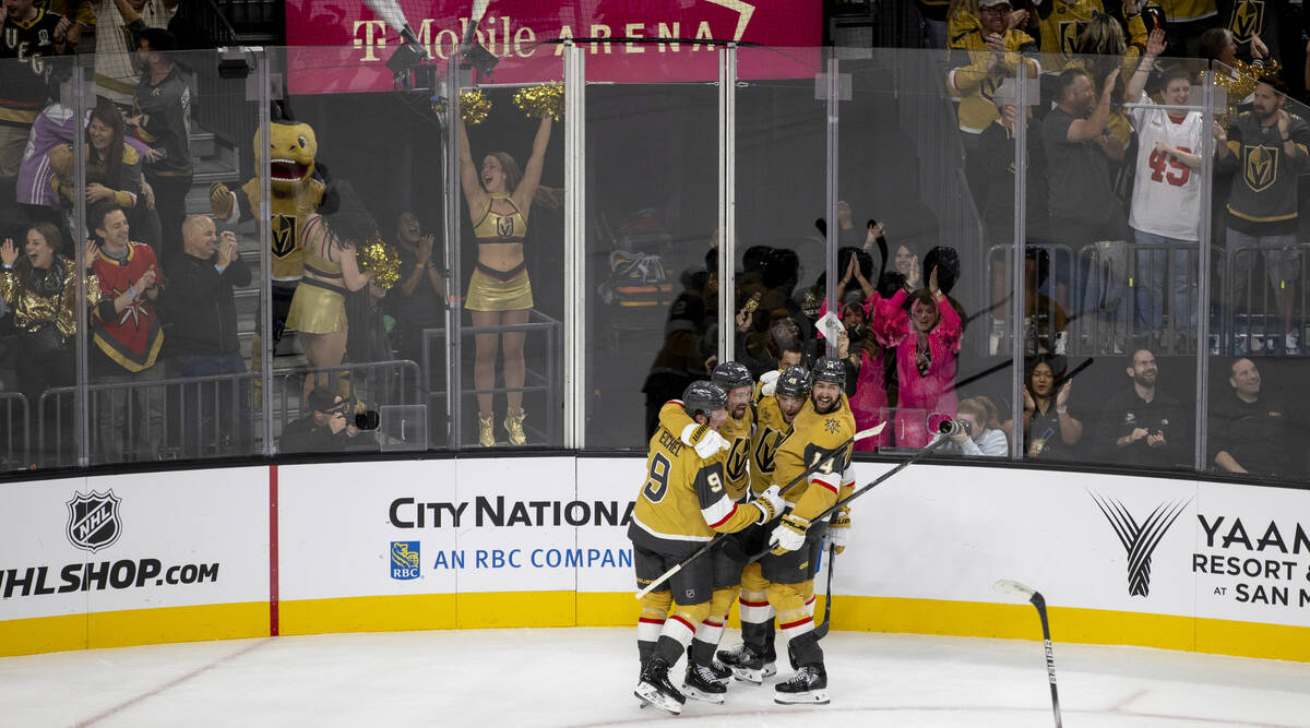 Vegas Golden Knights players celebrate a goal scored by right wing Mark Stone (61) during the f ...