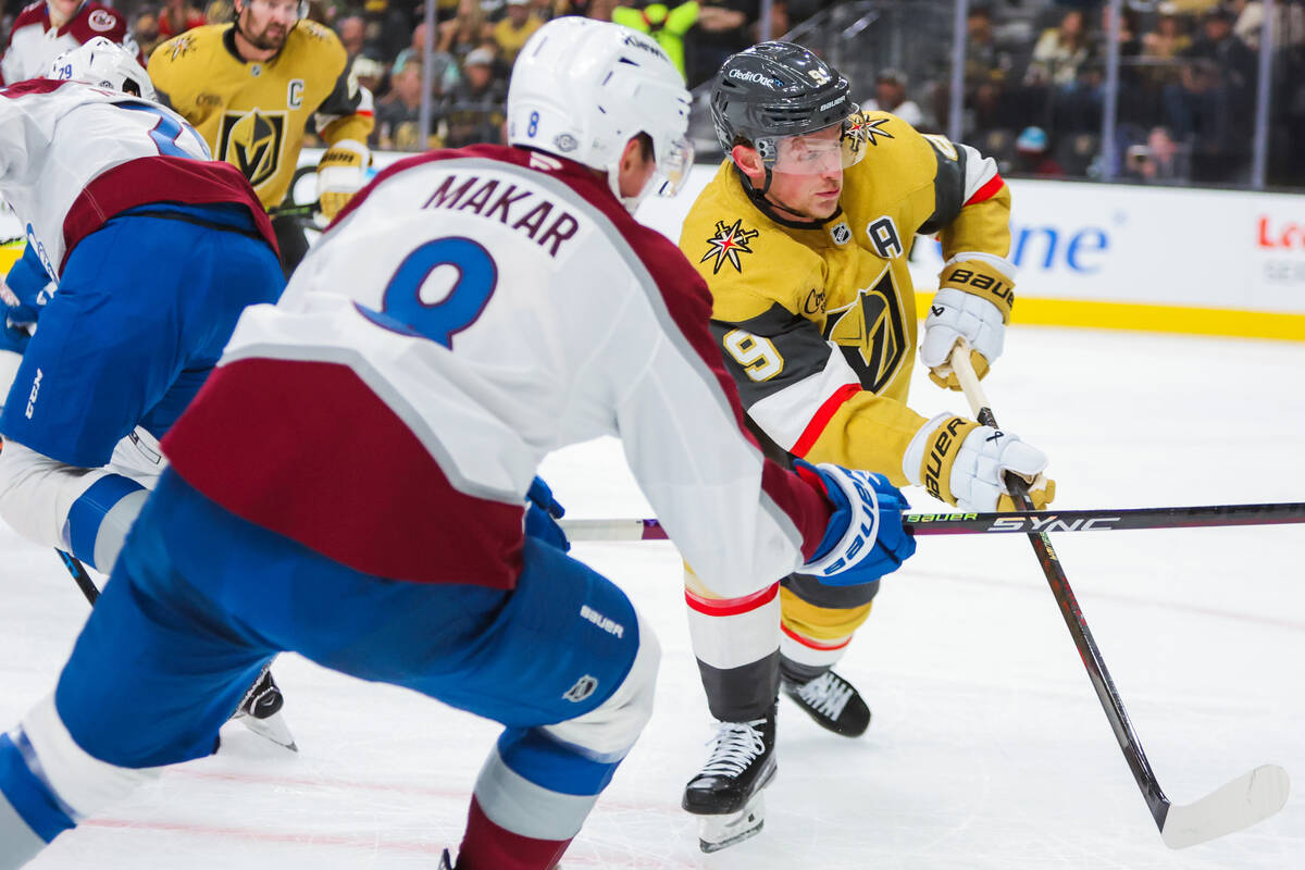 Golden Knights center Jack Eichel (9) hits the puck during the Golden Knights’ NHL hocke ...