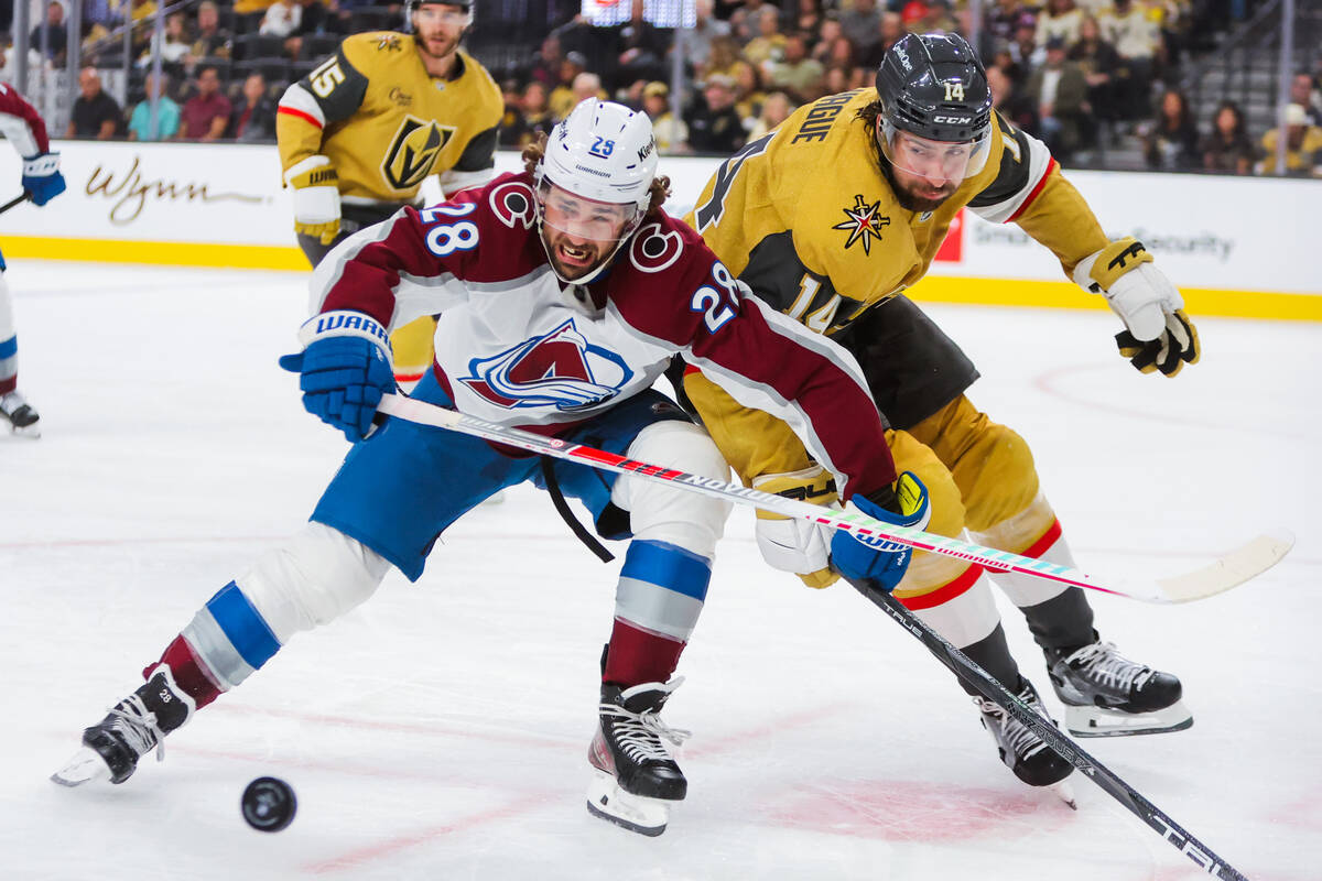 Colorado Avalanche left wing Miles Wood (28) and Golden Knights defenseman Nicolas Hague (14) c ...