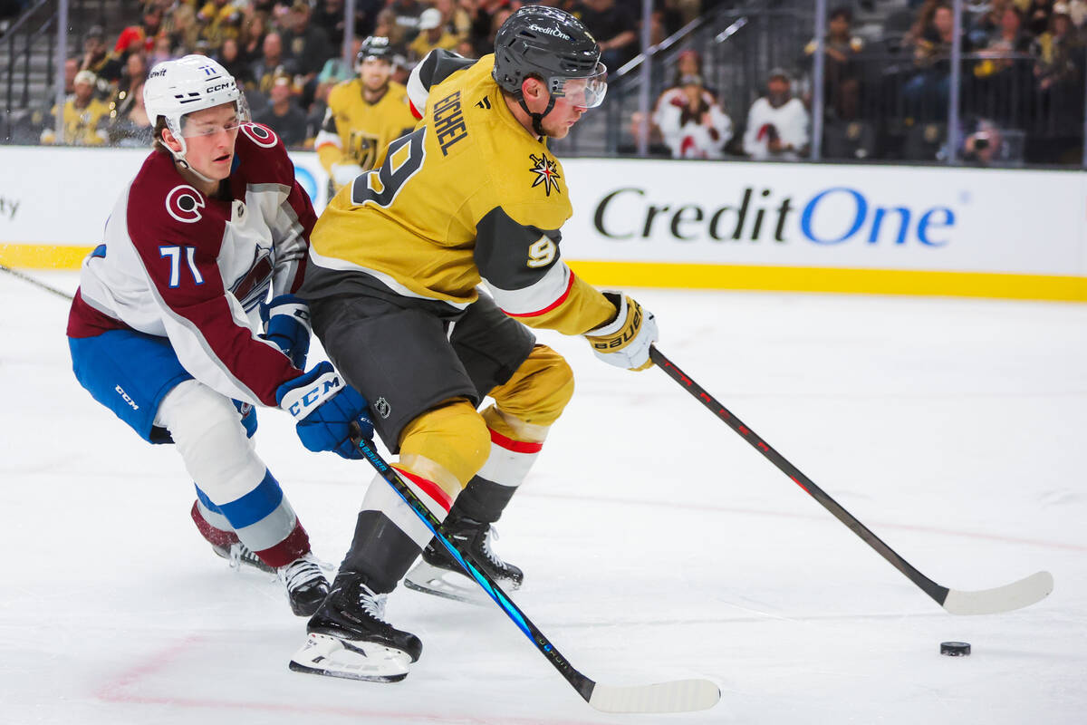 Golden Knights center Jack Eichel (9) controls the puck as Colorado Avalanche center Calum Ritc ...