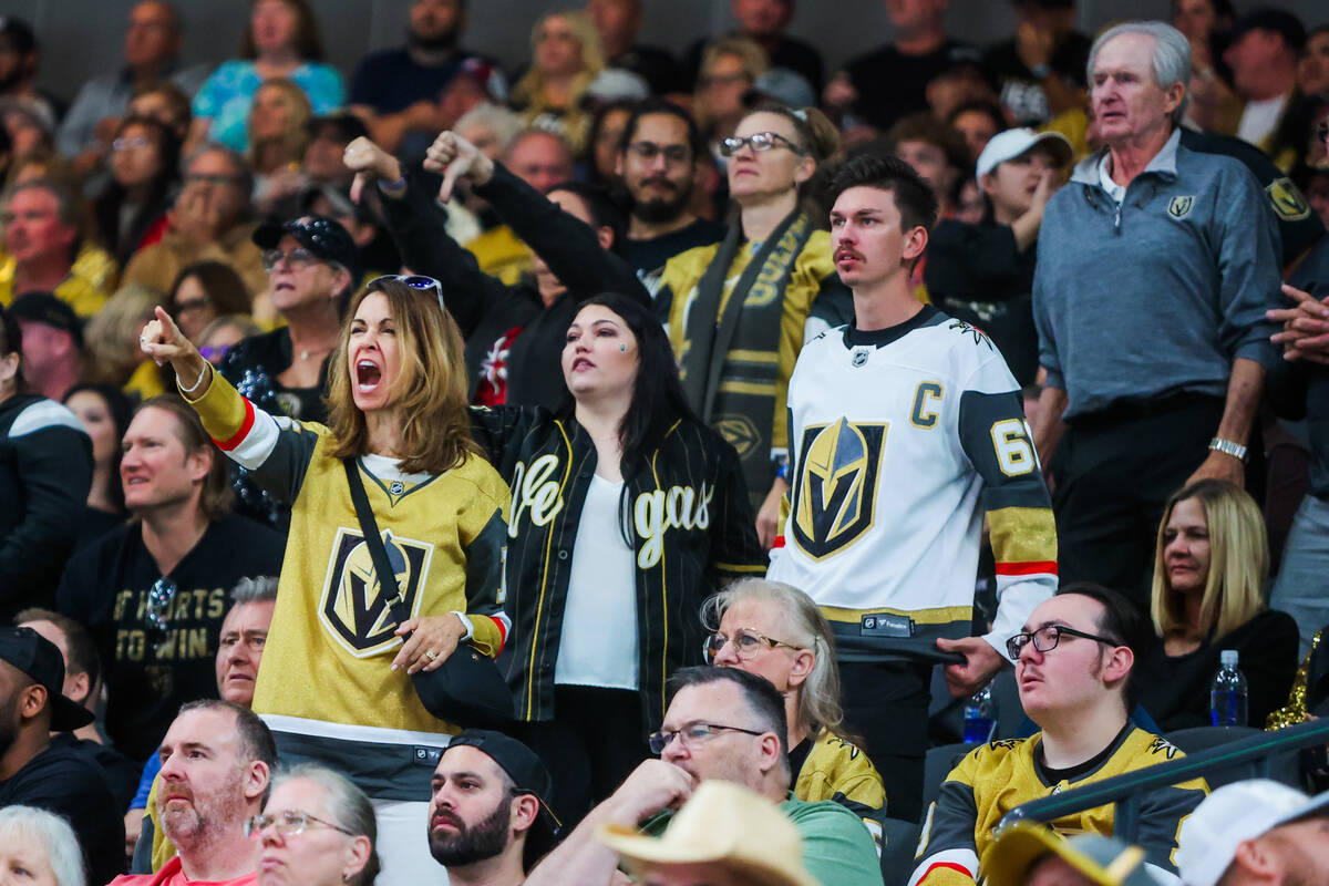 Golden Knights fans yell at Colorado Avalanche players during the Golden Knights’ NHL ho ...